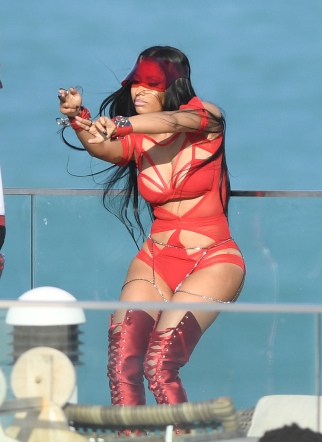 EXCLUSIVE: February 27, 2017: Nicki Minaj shows off her famous curves in a red cutout bodysuit as she films a video with rapper Future in Miami Beach, Florida. -PICTURED: Nicki Minaj -PHOTO by: INSTARimages.com -Instar_Nicki_Minaj_Future_EXC_0730642245 Editorial Rights Managed Image - Please contact www.INSTARimages.com for licensing fee and rights: North America Inquiries: email sales@instarimages.com or call 212.414.0207 - UK Inquiries: email ben@instarimages.com or call + 7715 698 715 - Australia Inquiries: email sarah@instarimages.com.au Êor call +02 9660 0500 Ð for any other Country, please email sales@instarimages.com. ÊImage or video may not be published in any way that is or might be deemed defamatory, libelous, pornographic, or obscene / Please consult our sales department for any clarification or question you may have - http://www.INSTARimages.com reserves the right to pursue unauthorized users of this image or video. If you are in violation of our intellectual property you may be liable for actual damages, loss of income, and profits you derive from the use of this image or video, and where appropriate, the cost of collection and/or statutory damage.